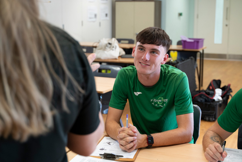 Learners working together at a table
